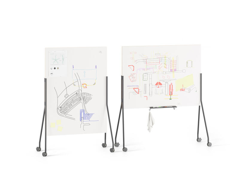 A duo of mobile double sided white and magnetic whiteboards with black aluminum stands and locking wheels designed by Michel Charlot for FAUST Linoleum