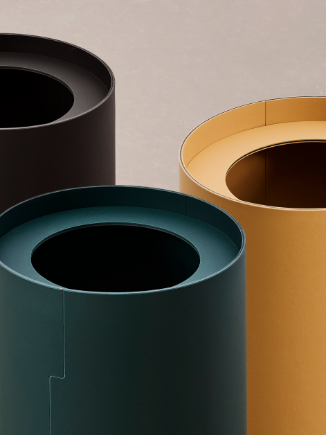 Close-up of the top part of three TIDY Paper Bins designed by Keiji Takeuchi in Conifer Leather and Nero shades of linoleum