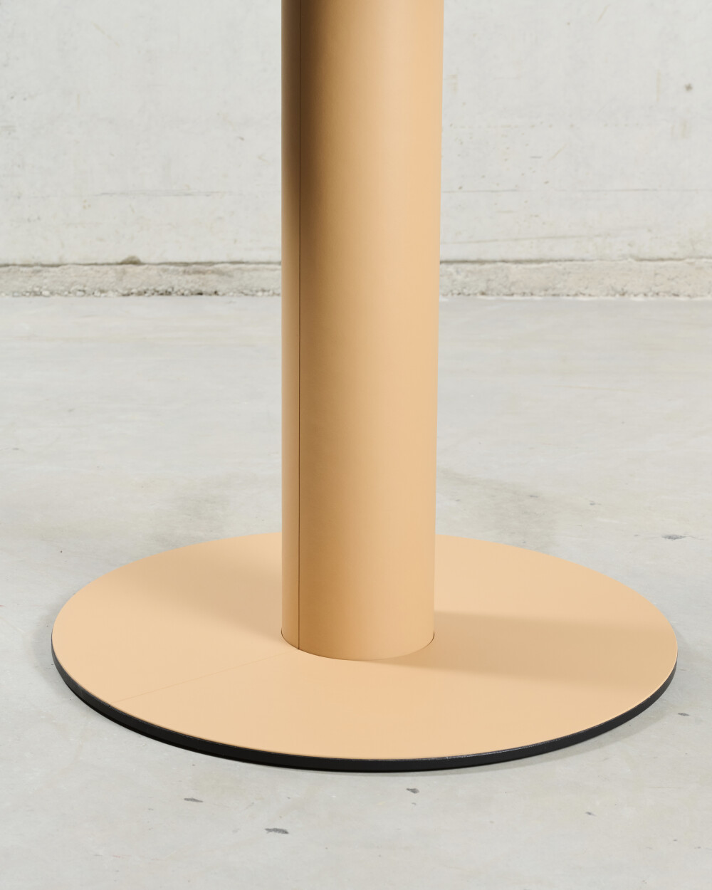 Detail of the SPOT Bistro Table base with removable magnetic linoleum cover for easy maintenance.
