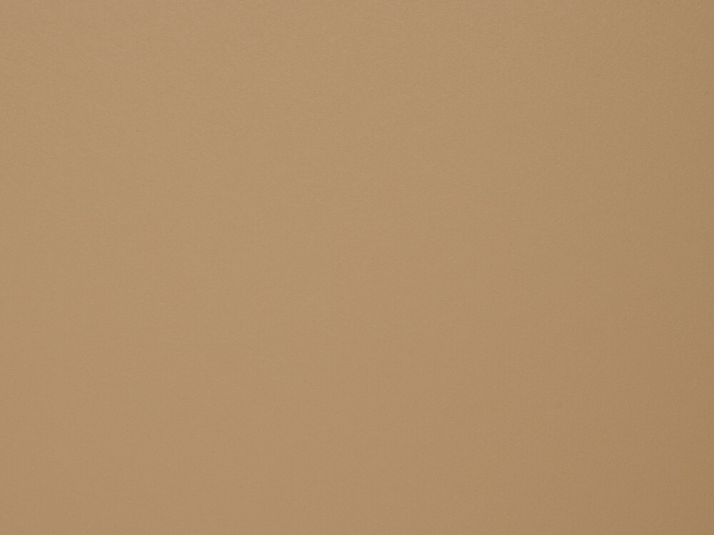 Linoleum-Oberfläche in Walnut – warme, matte Braunfläche mit feiner Textur, gezeigt als Materialdetail einer Tischplatte von Faust.