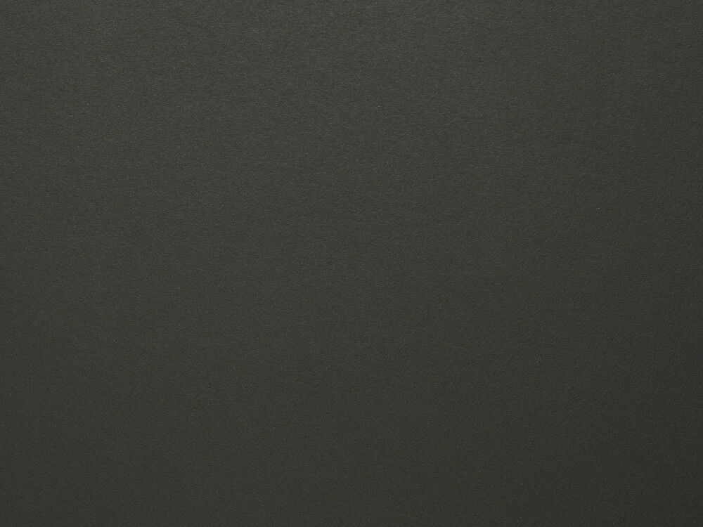 Linoleum-Oberfläche in Nero – matter, fein texturierter Belag in sattem Schwarz, dargestellt als Materialdetail einer Faust-Tischplatte.