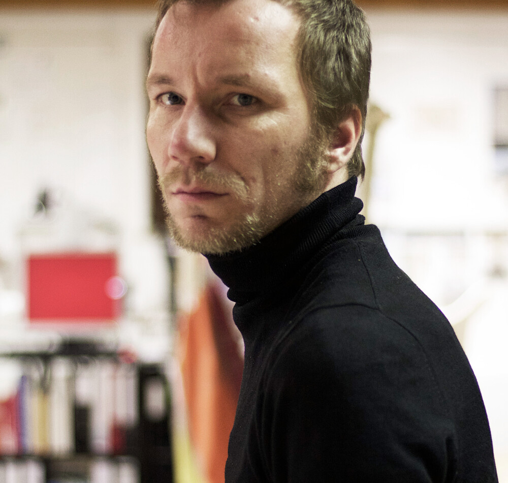Portrait of architect Michael Anton Kastenbauer for Faust - looking head-on into the camera, taken in a studio or atelier environment.