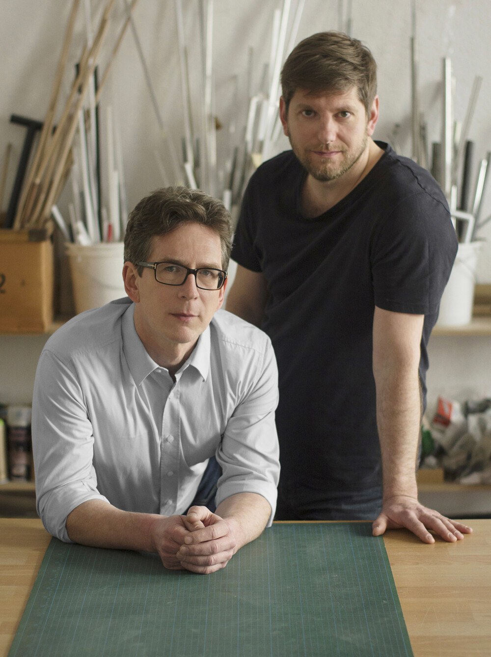 Portrait of the designers Hauke Murken and Sven Hansen in their Berlin studio - photographed for Faust at a work table with workshop character.