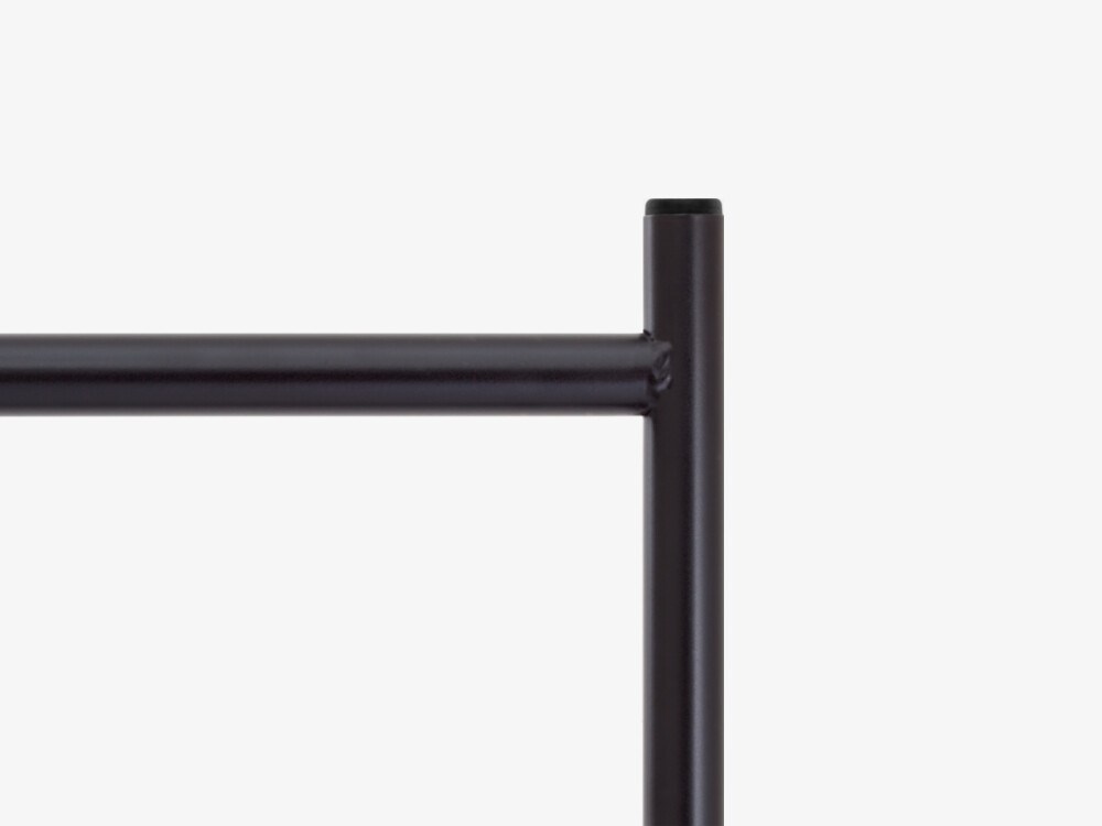 Detailed view of the E2 table frame in black – powder-coated steel tubing with clean, minimalist lines.