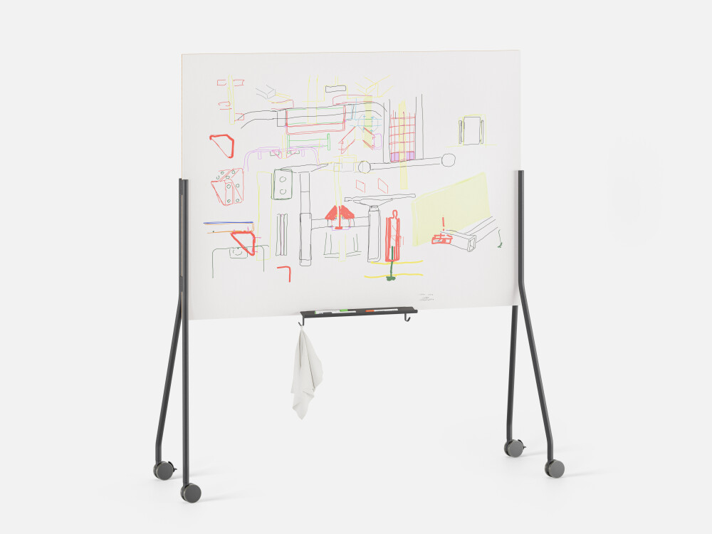 Mobile WALL notice board with white whiteboard surface, covered with colourful drawings and technical sketches.