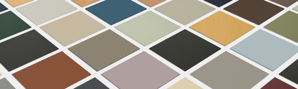 Free color sample set from Faust with linoleum and veneer samples – arranged diagonally as a fan on a white background.